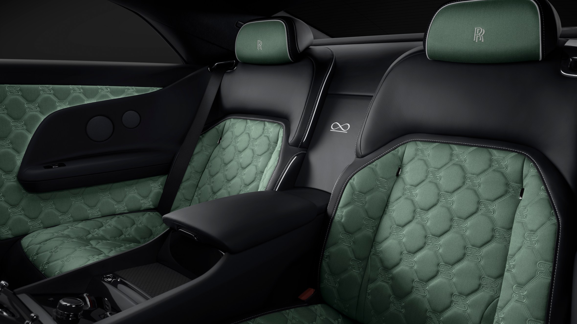 Rolls-Royce Black Badge interior with green upholstery and black leather.