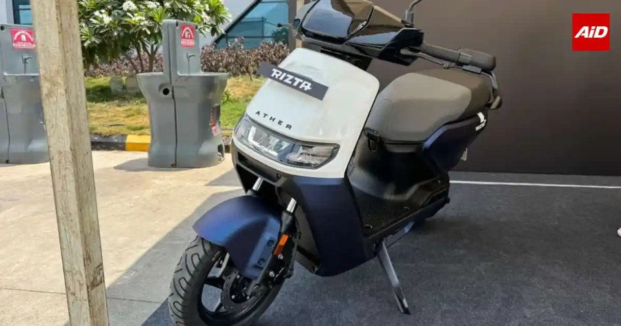 Simple Wave vs Rivals comparison showing the Ather Rizta electric scooter in white and blue.